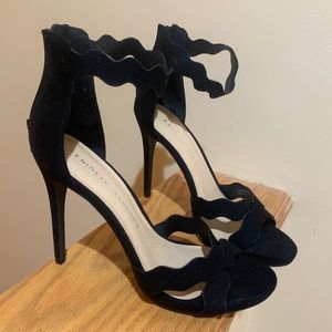 Black suede scallop heels